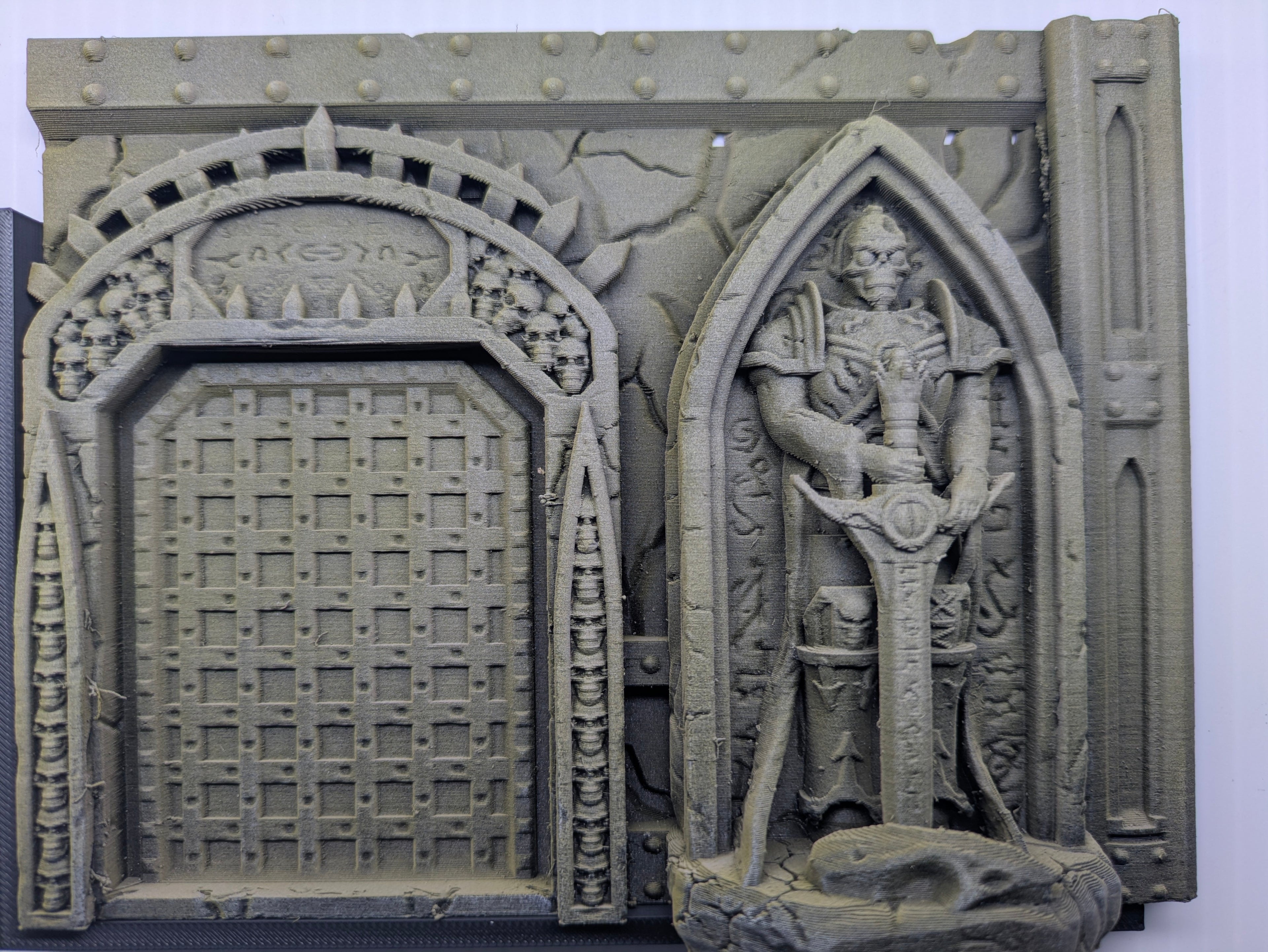 Decorative stone archway with intricate carvings on a white background