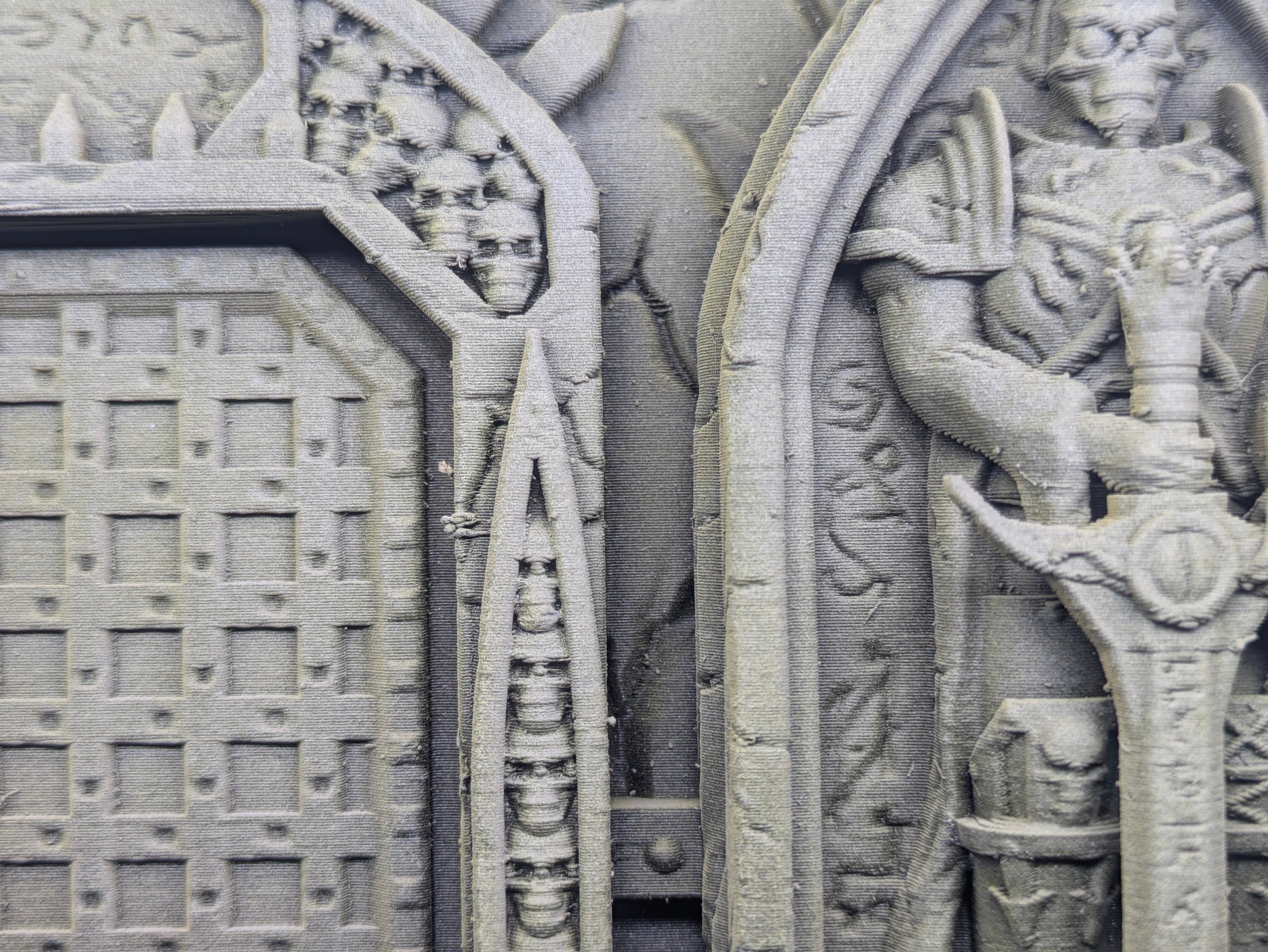Close-up of a textured surface with architectural elements and a waffle iron.