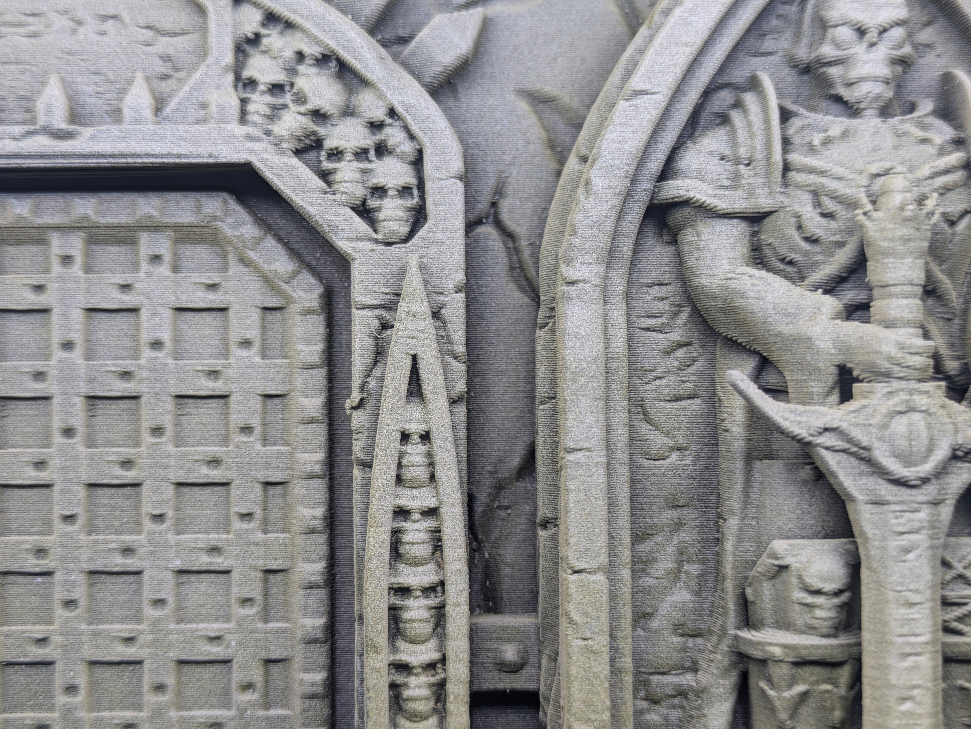 Close-up of a stone carving with intricate designs and patterns.