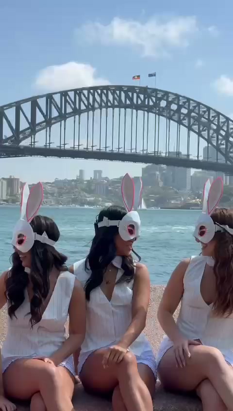 Performers in bunny masks with Sydney Harbour Bridge behind
