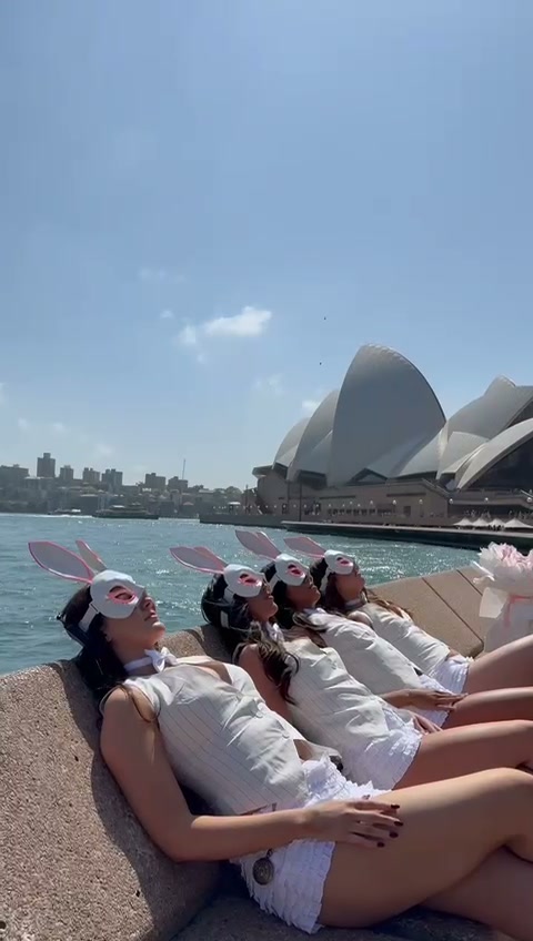 Performers wearing bunny masks at the Sydney Opera House