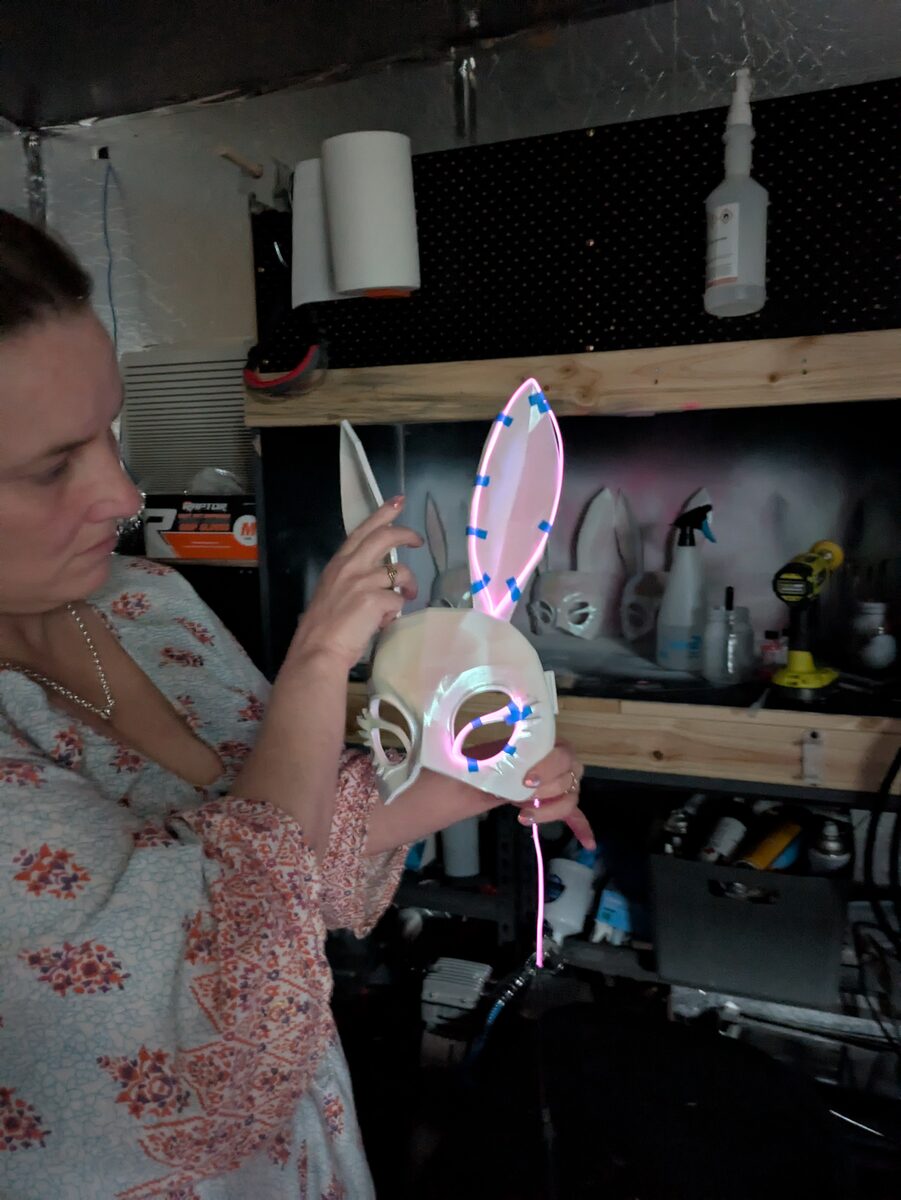 LED bunny mask being assembled in workshop